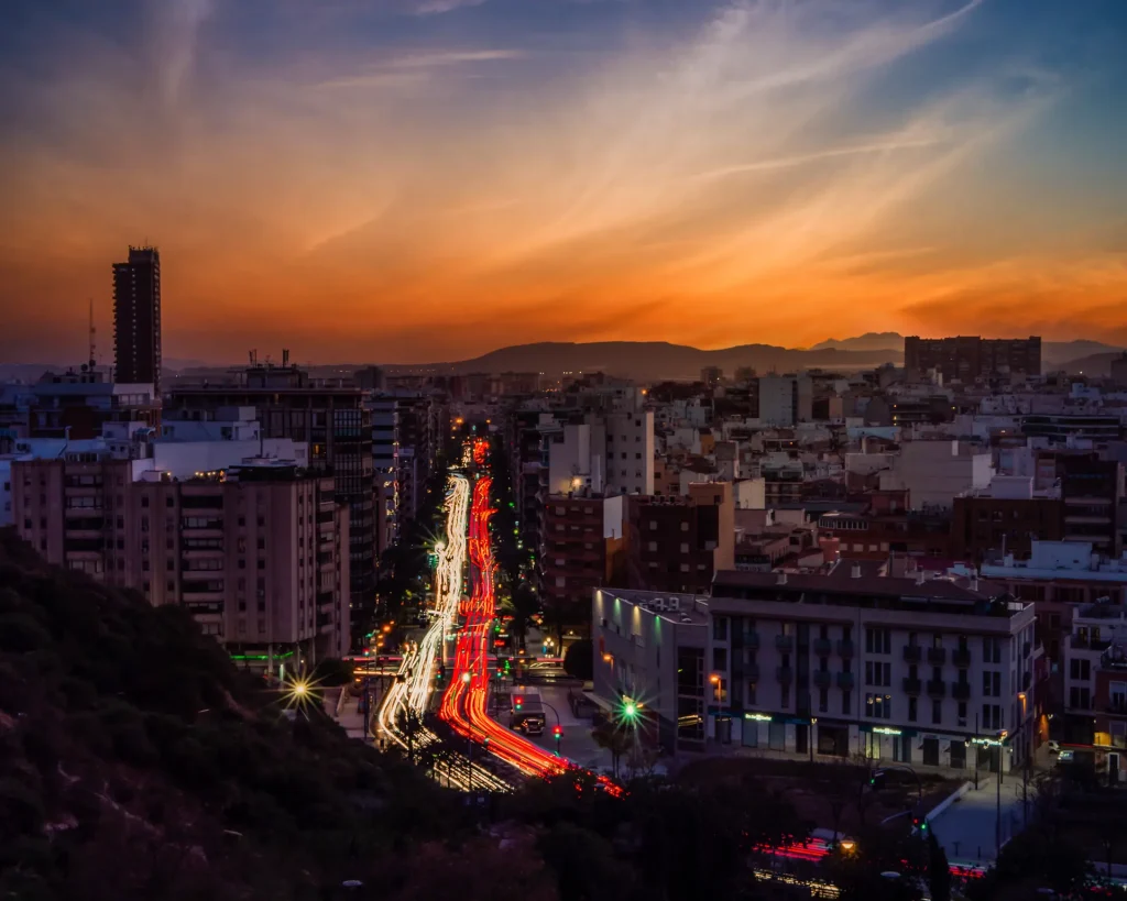 cityscape-modern-city-surrounded-by-lights-with-long-exposure-beautiful-sunset