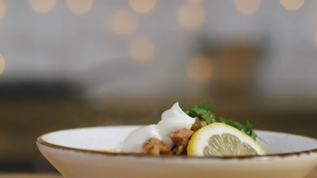 closeup-some-persons-hand-adding-sour-cream-bowl-with-solyanka-stock-footage-russian